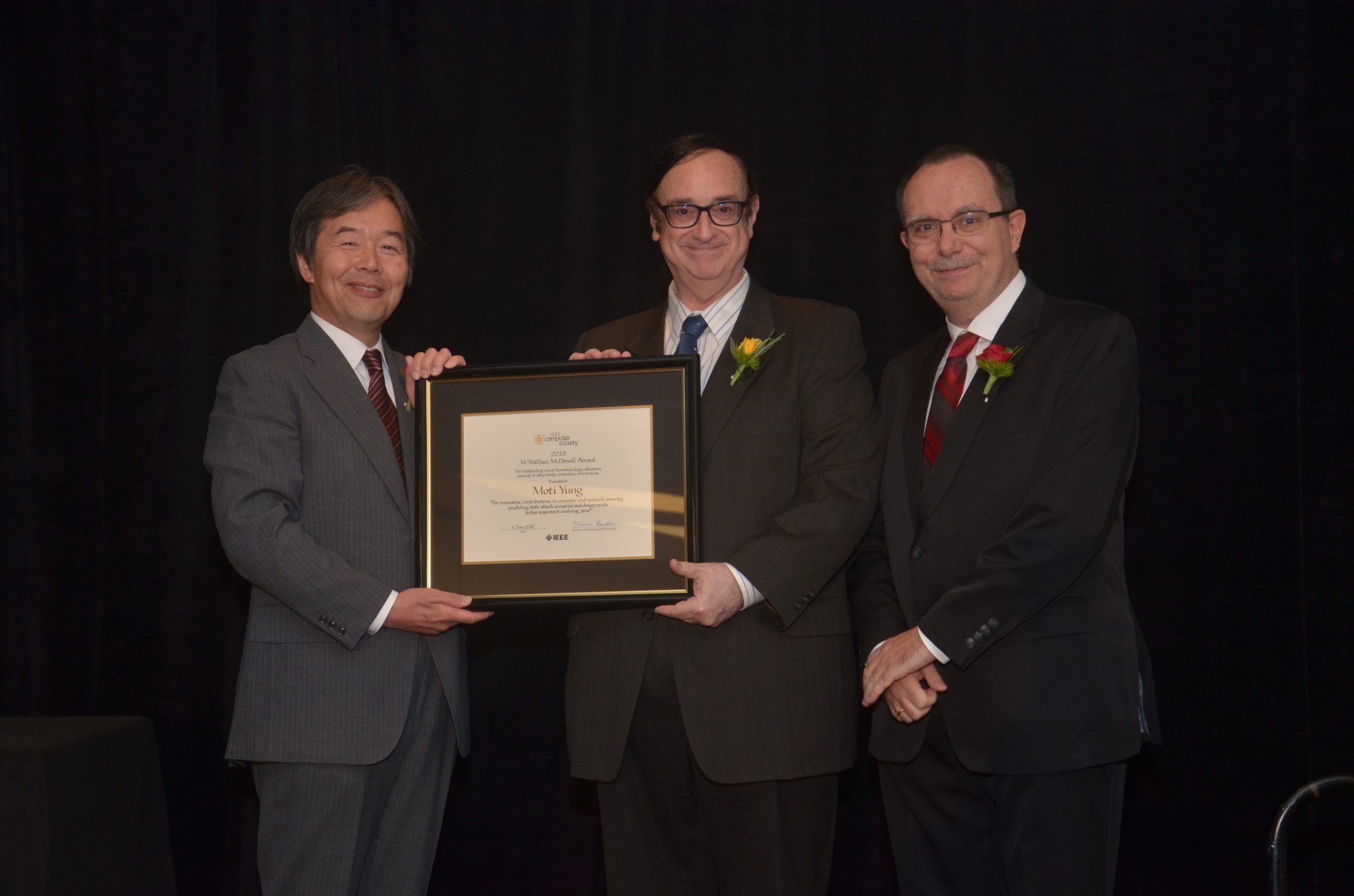 Dr. Moti Yung (center), fellow of IEEE and ACM, receives the IEEE Computer Society 2018 W. Wallace McDowell Award. 