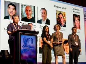 people standing on a conference stage