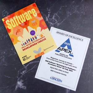 Picture of the IEEE Software issue next to the award issued by Apex